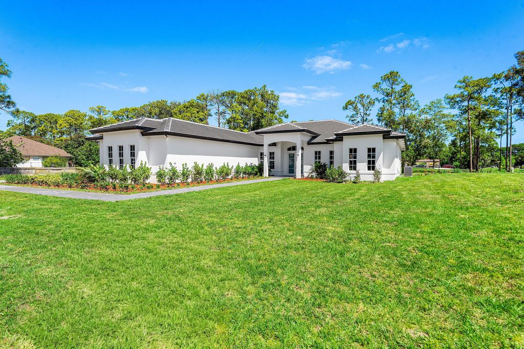 Photo of 10509 Temple Boulevard, The Acreage, FL 33470 (MLS # B26019487)