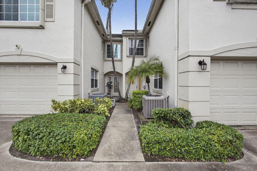 Vacant and move-in ready! This beautifully maintained Golf Estate Villas townhome offers incredible value at $395,000 with a low HOA of just $209/month. Enjoy wide-open canal and green space views from your private, covered screen patio. Built with durable CBS construction and a barrel tile roof, this home features an open kitchen with a pantry, tile floors downstairs, and beautiful wood laminate upstairs. The oversized garage provides plenty of shelving and storage space. Inside, you'll find spacious living areas, a bright kitchen, and comfortable bedrooms - the perfect blend of convenience and lifestyle.
