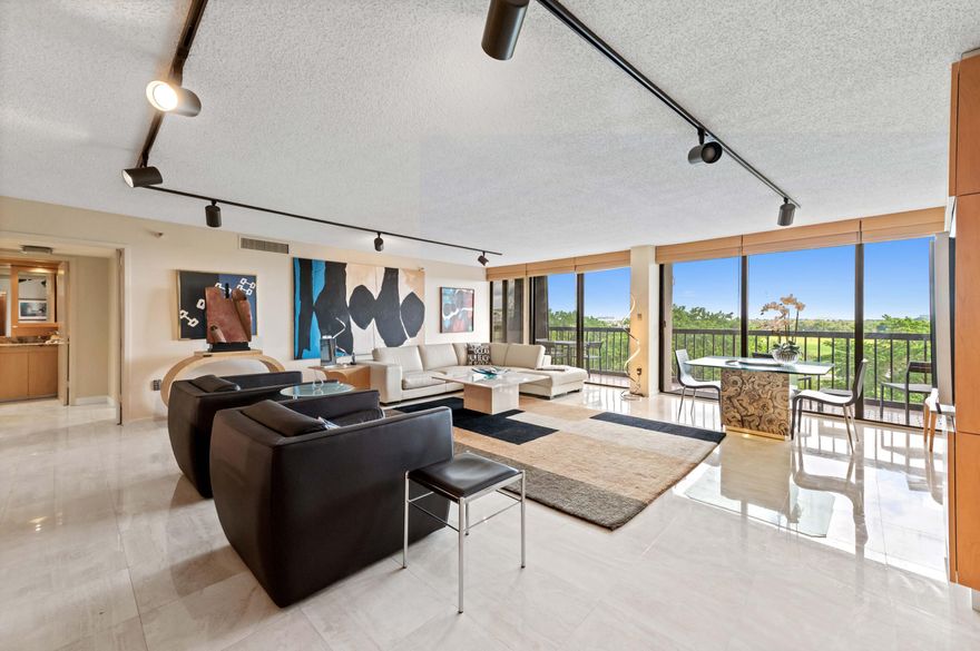 Fully turnkey, designer-renovated residence—one of the most upgraded  move-in ready homes in the building. This exceptional property has been completely reimagined by a renowned Palm Beach art and design firm, creating a designer-curated living experience that sets it apart from other units. Every detail has been thoughtfully considered, resulting in a space that feels both sophisticated and effortlessly comfortable. The open, light-filled floor plan is ideal for modern living and entertaining, featuring seamless marble flooring, rich oak finishes, custom millwork, and refined architectural details throughout.At the center of the home is a beautifully appointed chef's kitchen with premium appliances, quartz countertops,  custom cabinetry, blending function & style in a elevated aesthetic Expansive floor-to-ceiling sliding glass doors bring in abundant natural light and open to peaceful, private garden views, creating a serene and inviting retreat.    The thoughtfully designed split-bedroom layout offers both privacy and generous proportions, complemented by updated, spa-inspired bathrooms.    Located in a pet-friendly, full-service building within a secure gated community east of I-95, residents enjoy beautifully maintained grounds, excellent amenities, and convenient access to Palm Beach Island, shopping, dining, Kravis Center of Performing Arts and the magnificent State of the Art Norton Museum and major highways and PBI Airport.  Here is more information about the interior of the unit. The wood panels and doors are curly maple and tiger wood. Travertine and marble floors, channel wool carpets and Trefenkian Area Rugs Counters are Lapidius Granite. Sinks and toilets and fixtures are Kohler. Kitchen sink is Frandie and a GE monogram double wine cabinet for reds and white wines. Furniture is Roche Bobois. This building is located in a prime location with short distance to PBI Airport, Palm Beach Island and Beaches and West Palm Beach is truly a booming Mega Center for culture w/ Kravis Ctr, Norton Museum, fine shopping and dining.  Lands of the President is just adjacent to the Tanner Outlet Mall w/ Whole Foods, Saks of Fifth, Nordstrom, Marshalls, Home Goods, and the recently newly opened Belgrove Marriott Autograph Hotel & the Dutchman's Pipe Country & Golf Club.