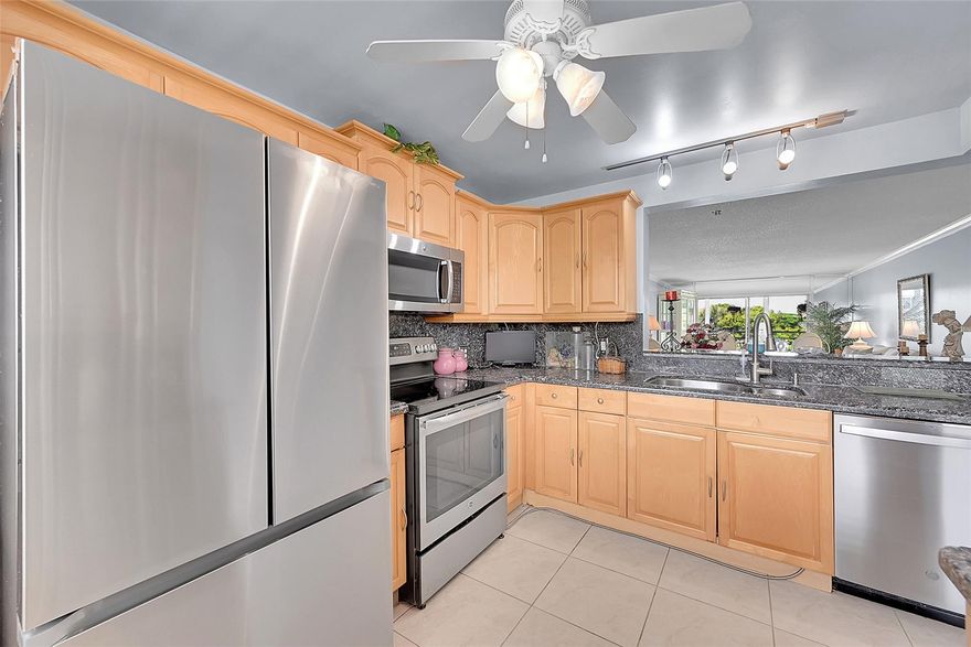 Beautifully Updated 2 Bedroom / 2 Bath Condo Overlooking the Pool!
Step into this inviting open-concept home featuring a bright updated kitchen with granite countertops, ceramic floors in the kitchen and living areas, and plush carpet in the bedrooms for comfort. Both bathrooms are tastefully updated, providing a modern touch throughout. Enjoy peace of mind with a newer A/C and a brand-new refrigerator. Relax on your private balcony while overlooking the sparkling pool. Nestled in a prime location, this condo offers convenience, style, and comfort—perfect for year-round living or a seasonal retreat! ASSOC REQUIRES 20% DOWN & 1 OCCUP 55+