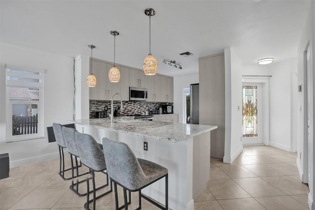 Photo of 1235 NW 51st Street, Deerfield Beach, FL 33442 (MLS # F10542549)