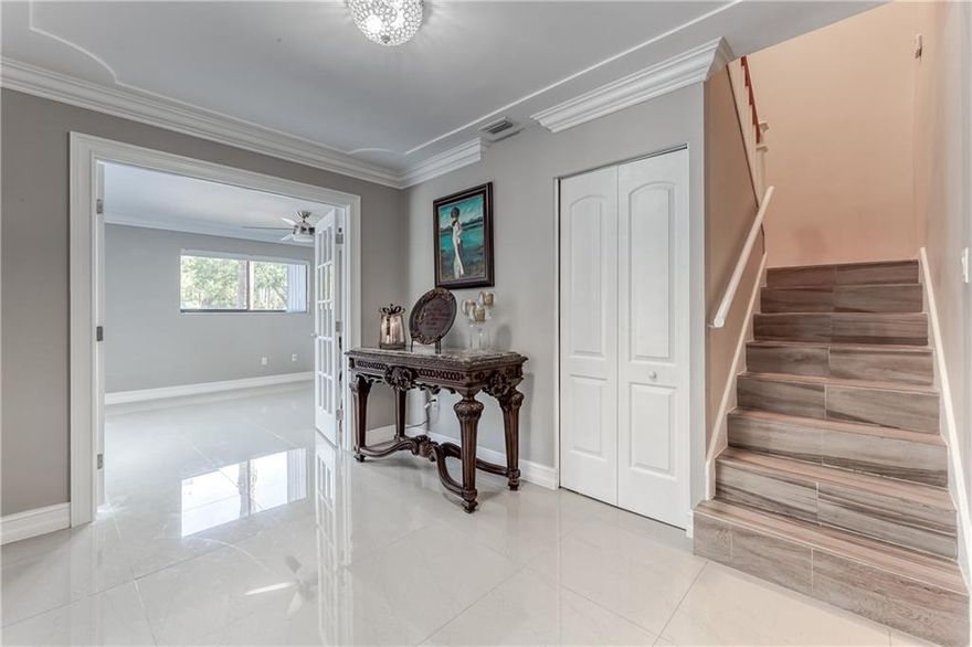 This is a fantastic 3-2 Townhouse located in, The Country community of Lake Worth.  Enter in through a very large screened in patio area. The first floor has many upgrades...  all tile, ceiling lighting and crown moldings.  Both bathrooms one downstairs and one upstairs have been completely remodeled. The kitchen has all new appliances (2018),  new counter tops and cabinets. Enter into the downstairs bedroom through double French doors.  The staircase has a new banister that leads to the upstairs master bedroom with a walk in closet and attic space for more storage. The 3rd bedroom upstairs has wall to wall closet space. Notice of Termite Inspection and treatment 2/10/2021