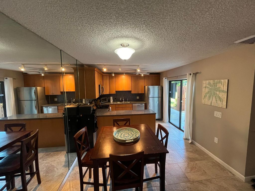 Photo of 5618 SE Windsong Lane #428, Stuart, FL 34997 (MLS # R11040661)