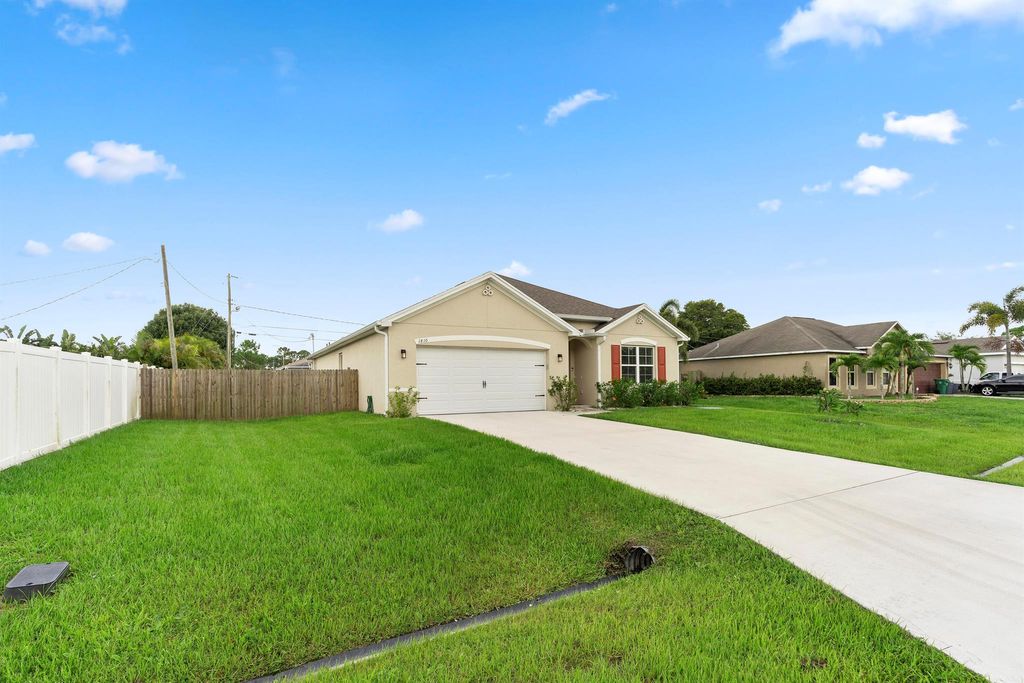 Photo of 1810 SW Capehart Avenue, Port Saint Lucie, FL 34953 (MLS # R11101006)