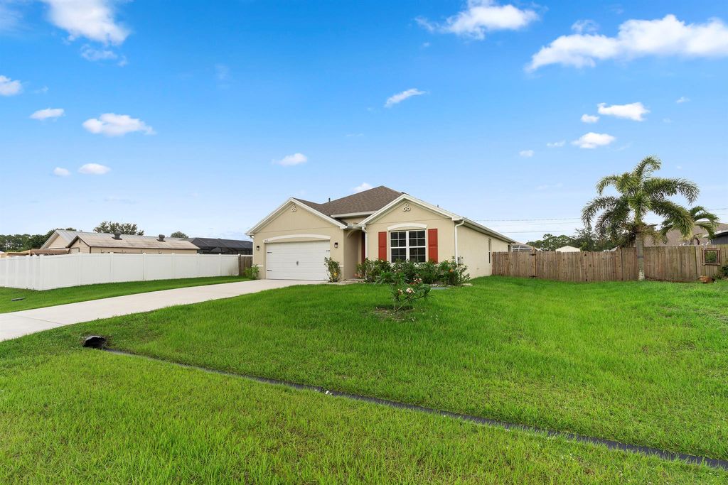 Photo of 1810 SW Capehart Avenue, Port Saint Lucie, FL 34953 (MLS # R11101006)