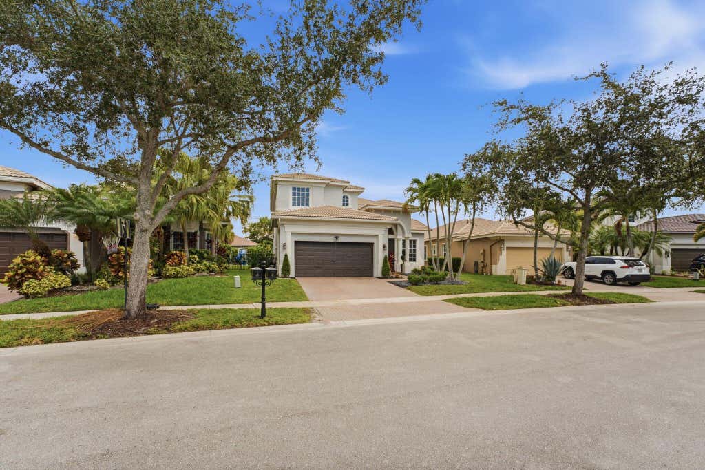 Photo of 12339 NW 77th Manor, Parkland, FL 33076 (MLS # B26048054)