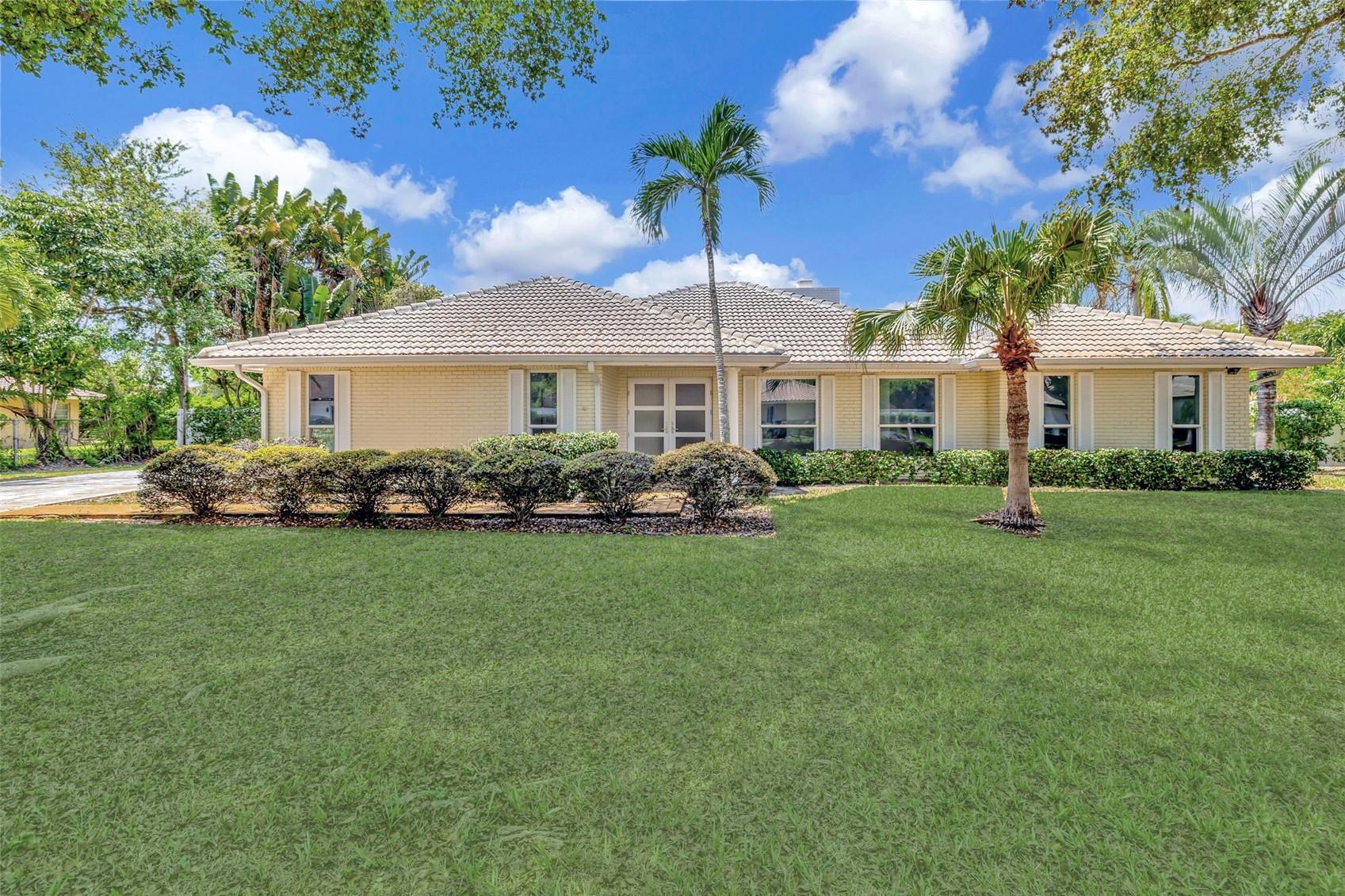 This remarkable 3-bedroom, 2.5-bath home is situated in one of Coral Springs' most desirable, tranquil
neighborhoods. True squared footage is over 3,096sqft! NEW ROOF (2022!) - Originally a 4 bedroom layout, this
home brings you two expansive owner’s suites, perfect for multi-generational living, guests, or creating a luxurious personal retreat. Sky lights offer natural lighting in the open living and dining areas where a charming brick fireplace adds warmth and character. Energy-conscious upgrades include IMPACT WINDOWS, SOLAR WATER HEATER, ELECTRIC CAR CHARGE PORT, and recently updated electrical panel. A/C is 2018. With no HOA, and just minutes from top schools, parks, shopping, and dining, this home provides an unparalleled combination of comfort, style, and convenience.