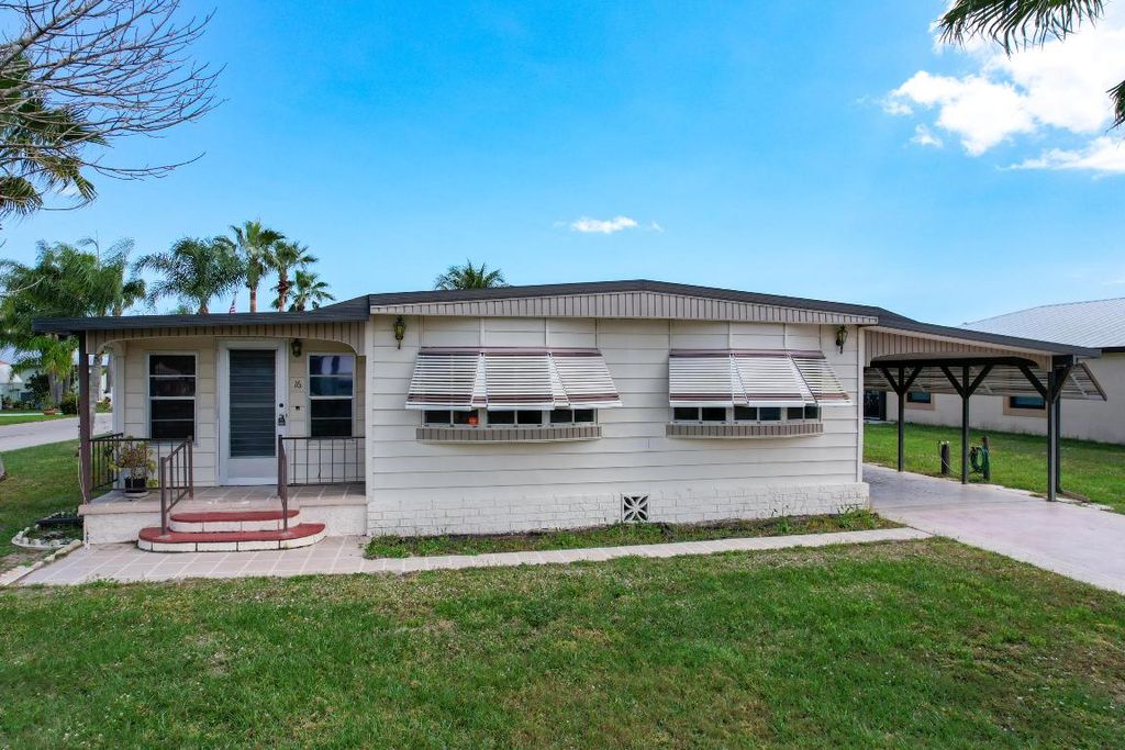 Photo of 16 SE Casa Rio Road, Port Saint Lucie, FL 34952 (MLS # R10971293)