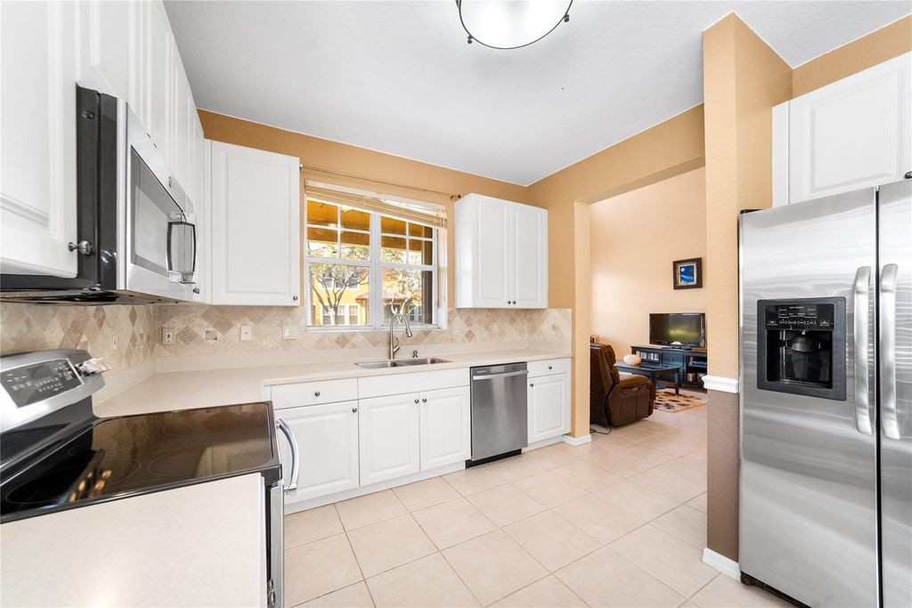 Photo of 5772 NW 119th Drive, Coral Springs, FL 33076 (MLS # F10543822)