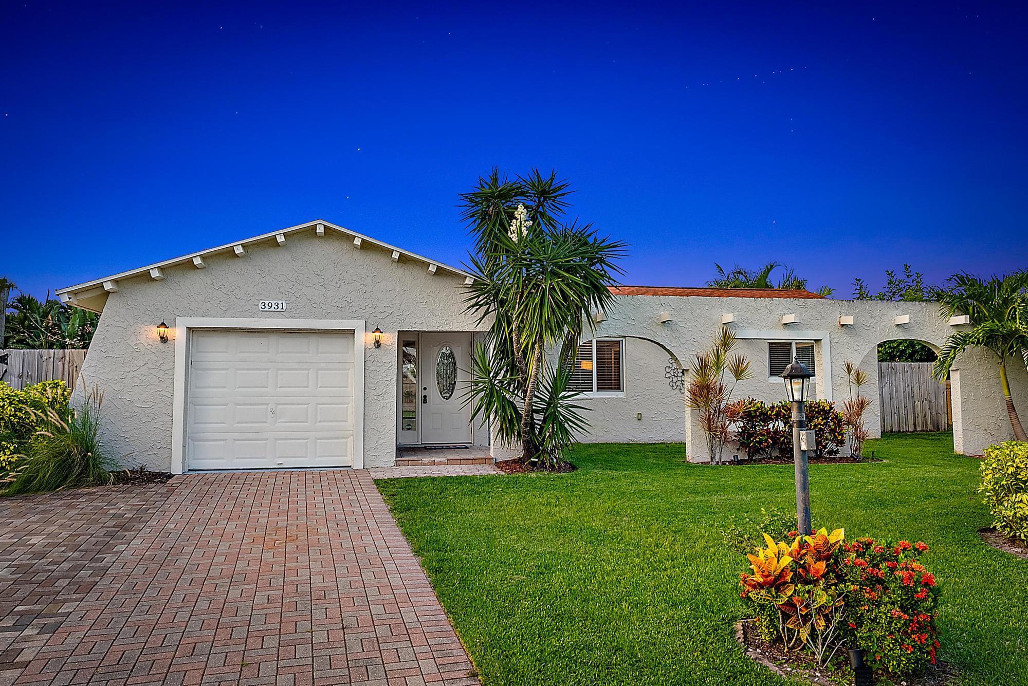 Welcome to 3931 Flag Drive in Palm Beach Gardens, the perfect blend of comfort, convenience, and the South Florida lifestyle! This beautifully maintained 3-bedroom, 2-bathroom home offers a split floor plan with laminate flooring throughout, creating a seamless and low-maintenance living space. The spacious primary suite includes ample closet space and a private bathroom, while the guest bedrooms are thoughtfully positioned for privacy and share a full bathroom with a shower/tub combo, ideal for family or visitors.