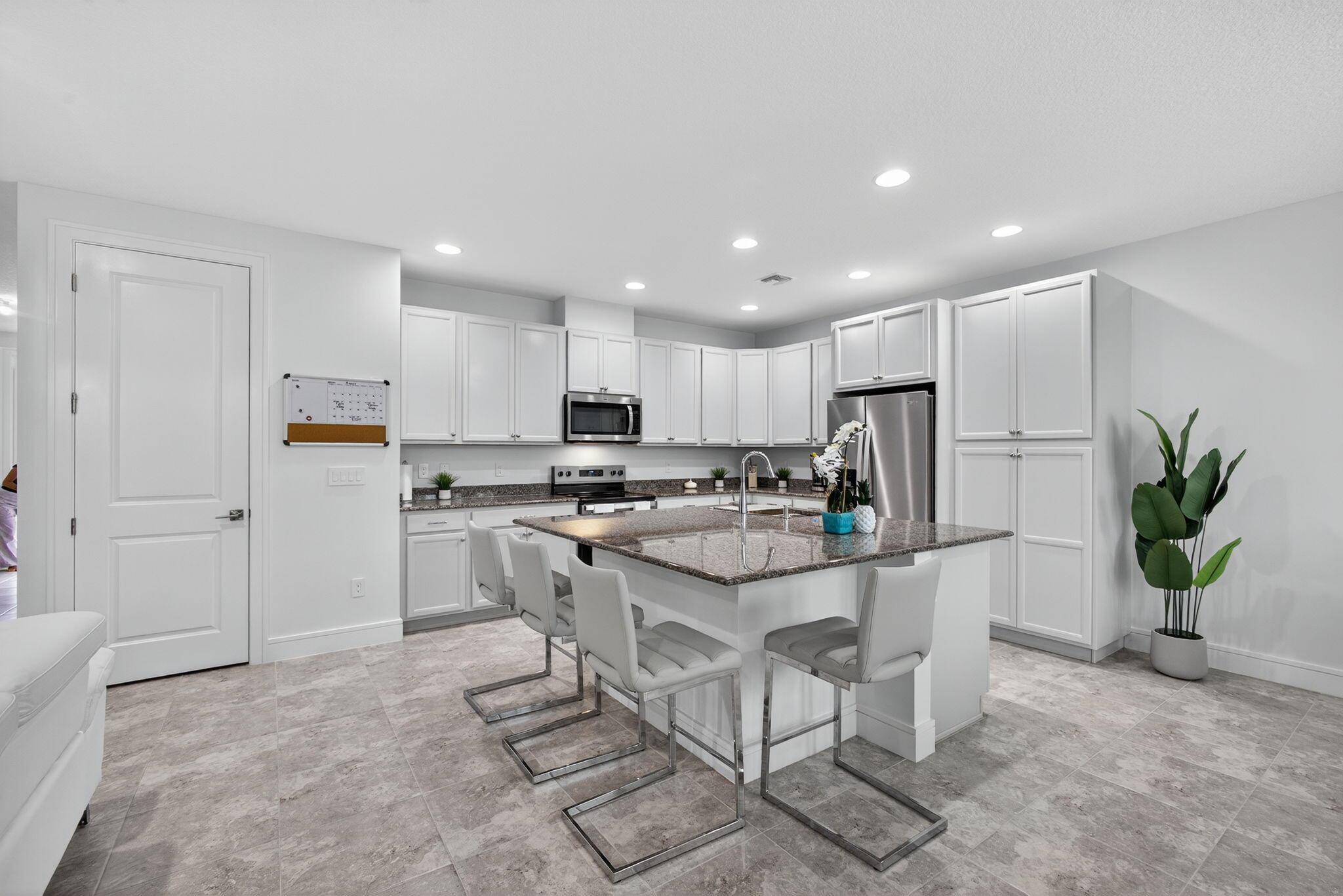 Modern Townhome in The Crossings at Westlake.Welcome to this stunning 3-bedroom, 2.5-bath townhome, built in 2024 and thoughtfully enhanced with stylish upgrades and finishes. From the moment you step inside, you'll appreciate the attention to detail and modern design touches that make this home move-in ready. The spacious open floor plan is complemented by fresh designer paint, new baseboards, upgraded door casings, and sleek modern switch plates, creating a clean and contemporary look throughout. The primary bedroom features upgraded ceilings and walls, adding a touch of elegance and sophistication to your private retreat. Additional upgrades include epoxy flooring in the garage for durability and style, and impact windows throughout, offering peace of mind and energy efficiency.