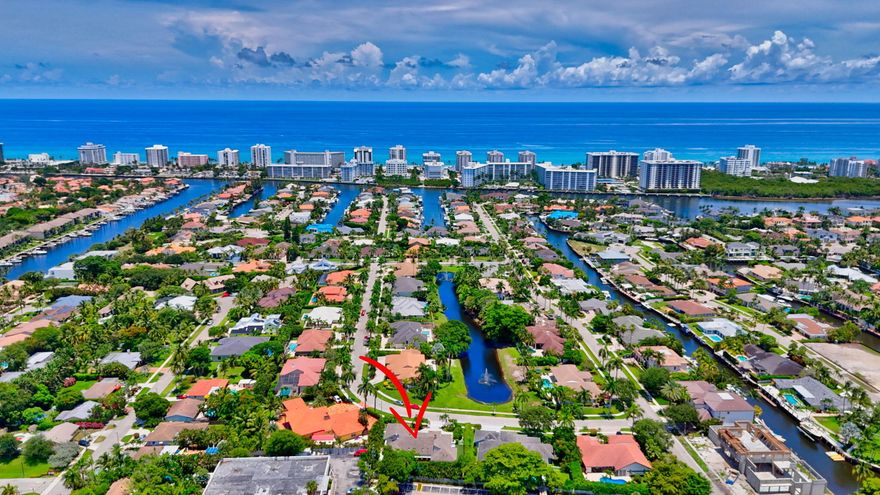 Welcome to this East Boca LUXURY COASTAL CONTEMPORARY RETREAT tucked away in the prestigious and highly sought-after Morningside community, just minutes from Boca's pristine beaches and vibrant downtown. This sprawling 5-bedroom, 4-bathroom estate offers an exceptional blend of elegance, comfort, and refined South Florida living with nice views of the lake and water feature. This single-story residence spans over 3,300 square feet of living space and showcases meticulous upgrades throughout. From the moment you enter, you're greeted by soaring vaulted ceilings, an abundance of natural light, and a wood-burning fireplace that serves as a warm focal point in the expansive main living area. Skylights and oversized windows flood the home with sunshine, creating a bright, airy ambiance that's both sophisticated and inviting. Designed with a triple-split floor plan, the home provides enhanced privacy for residents and guests alike. The primary suite is a true sanctuary, featuring two large custom walk-in closets, a beautiful spa-style bathroom, and peaceful views of the lushly landscaped backyard. The heart of the home   the chef-inspired kitchen   has been fully modernized with stainless steel appliances, custom cabinetry, and gleaming granite and quartz counters, perfect for hosting or daily family meals. A dedicated dining area flows seamlessly for easy entertaining, while a large indoor laundry room adds convenience. Step outside to your own private oasis. The backyard is a tropical retreat, featuring a resort-style pool with a rock waterfall, spa, and ample covered patio space ideal for outdoor dining, lounging, or entertaining on a grand scale. Other outstanding features include hurricane impact windows and doors, gorgeous Saturnia marble floors, $30k in landscaping, and more! This community is surrounded by the best of Boca Raton: world-class yacht clubs, golf courses, tennis facilities, upscale spas, fine dining, and premier shopping. With easy access to airports, top-rated schools, and elite medical centers, this location offers unmatched convenience and luxury. Come discover why Morningside is one of East Boca's best-kept secrets and why this home is one you won't want to leave.