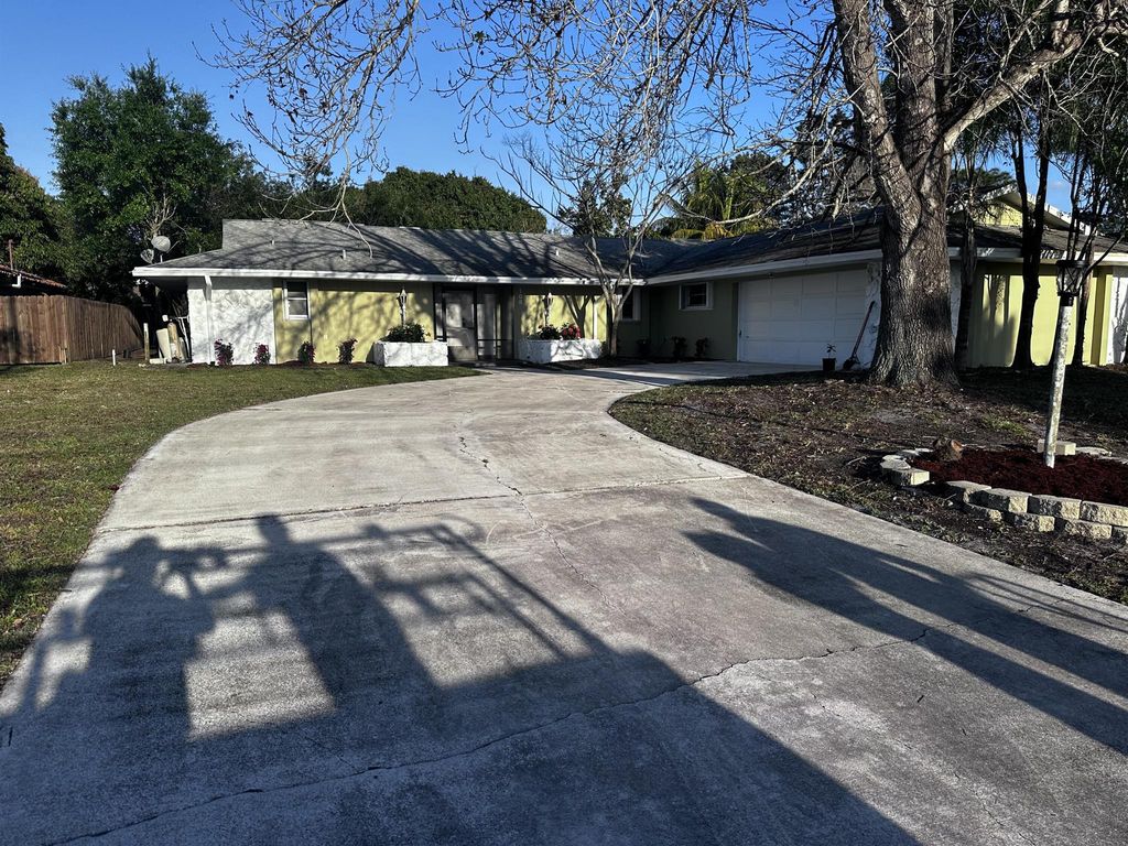 Photo of 108 NE Naranja Avenue, Port Saint Lucie, FL 34983 (MLS # R10963325)