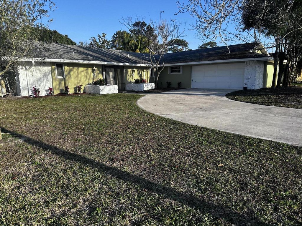 Photo of 108 NE Naranja Avenue, Port Saint Lucie, FL 34983 (MLS # R10963325)