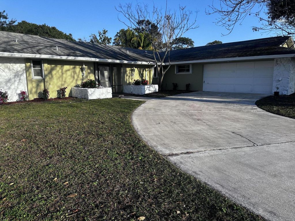 Photo of 108 NE Naranja Avenue, Port Saint Lucie, FL 34983 (MLS # R10963325)