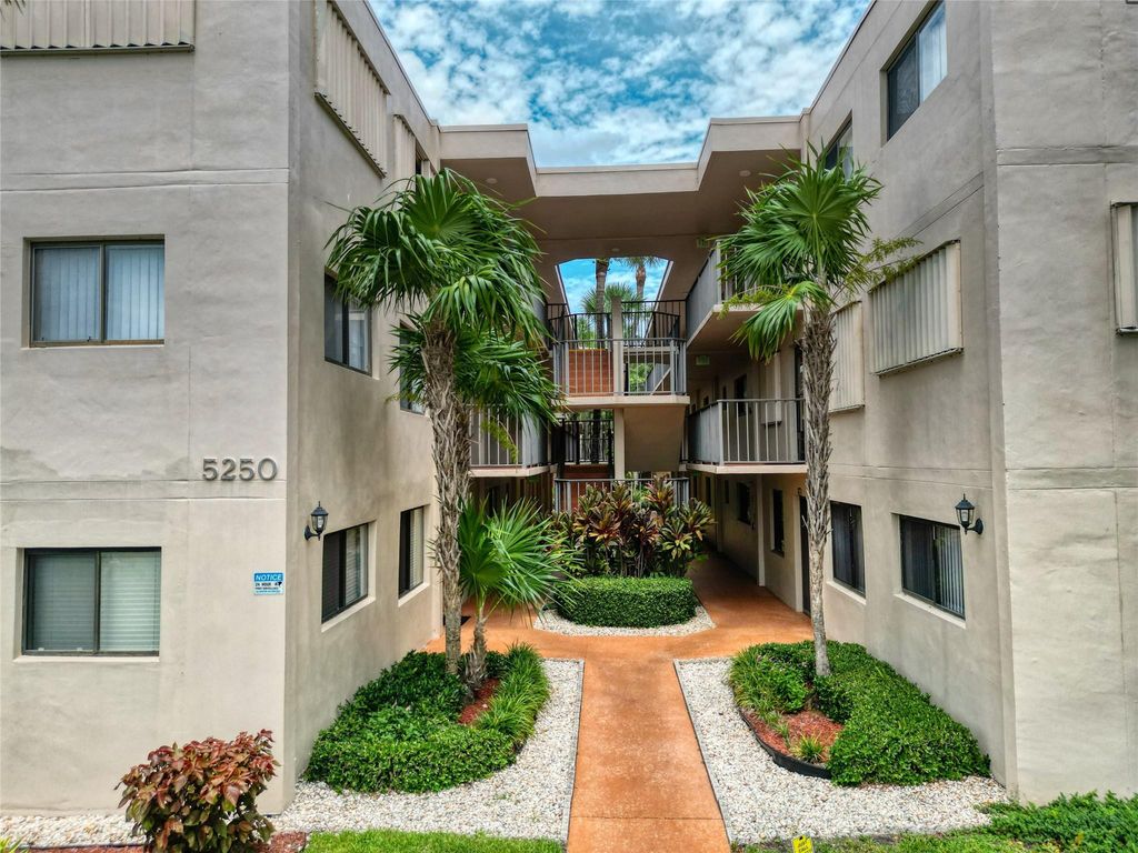 Photo of 5250 Las Verdes Circle #212, Delray Beach, FL 33484 (MLS # B26005848)