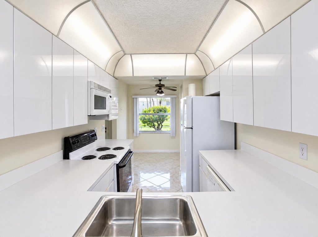 Photo of 7915 WILLOW SPRING DR #1218, Lake Worth, FL 33467 (MLS # B26079710)