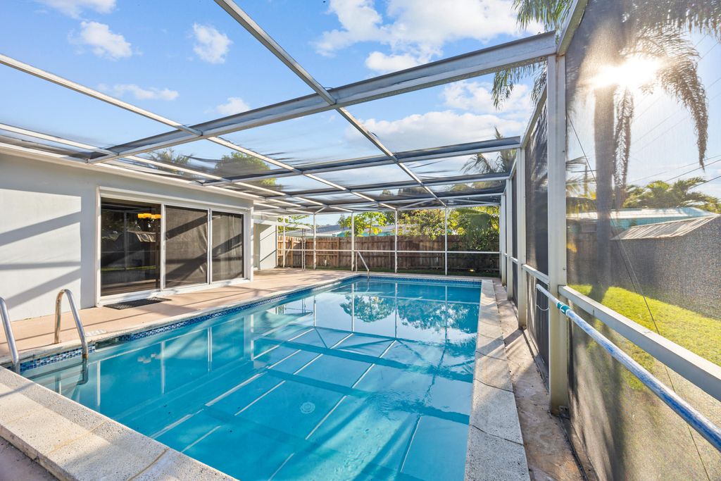 Photo of 748 W Jasmine Drive, Lake Park, FL 33403 (MLS # R11084172)