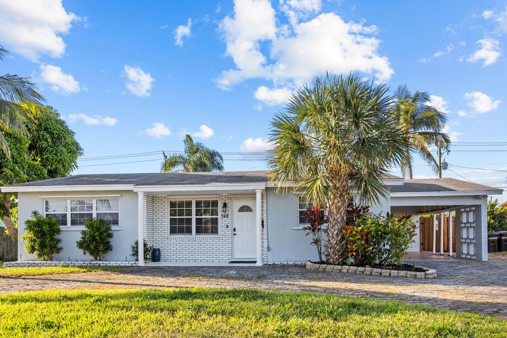 Photo of 748 W Jasmine Drive, Lake Park, FL 33403 (MLS # R11084172)