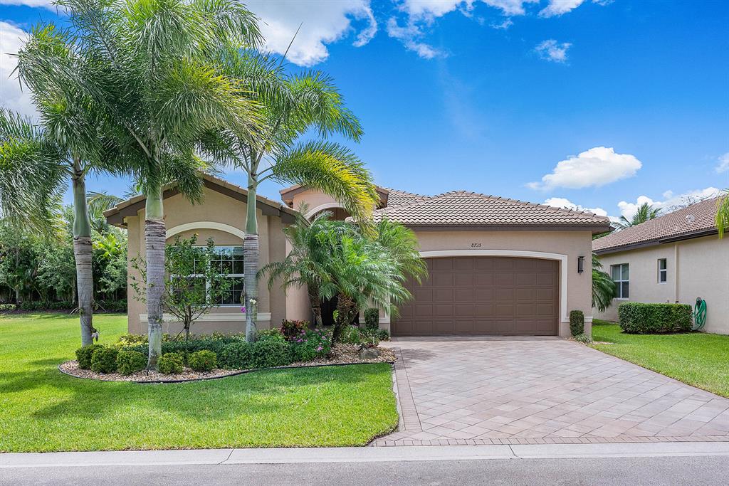 This beautifully appointed Atlantic Grande model sits on a south backing private corner lot.The 2 br+den,2.1 bath home has impact windows,designer light fixtures and window treatments,hi-hats,fans,built-ins,outfitted closets and upgraded baths.Marble has been installed on the diagonal throughout.The gourmet kitchen features off white wood cabinetry,quartz countertops,tile backsplash,stainless steel appliances and all the bells and whistles!There is an extended snack bar with pendant lights,breakfast area and dining room.The great room with built-in entertainment center is open to the kitchen.The den/office features a built-in desk.Master suite with luxurious bath.You'll love the oversized private corner lot with wraparound screened porch and lake views from all of the east windows.