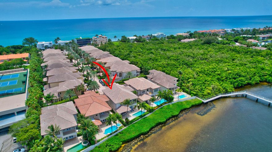 This stunning waterfront residence situated on the prestigious barrier island of Highland Beach located in the sought-after gated neighborhood of Ocean Cove has beach access just steps away. The heart of this residence lies in its direct Intracoastal waterfront location, offering unobstructed panoramic views of the glistening waters and a 50 FT deeded dock.  With 5300+ square feet under air, this remarkable pool home boasts 4 beds, 4 baths, a media/office space, and a spacious 3-car garage providing ample room for both comfort and functionality.  The chef's kitchen, featuring top-line appliances and custom cabinetry, is a culinary enthusiast's dream.  Retreat in your private elevator to the Master Suite and other en-suite bedrooms for relaxation and tranquility.  (MORE) This smart home is being offered completely furnished by a skilled designer which reflects modern elegance, timeless charm and coastal living.  This exceptional waterfront residence is a once in a lifetime opportunity to embrace your coastal lifestyle and feel that every day life becomes an endless vacation.
