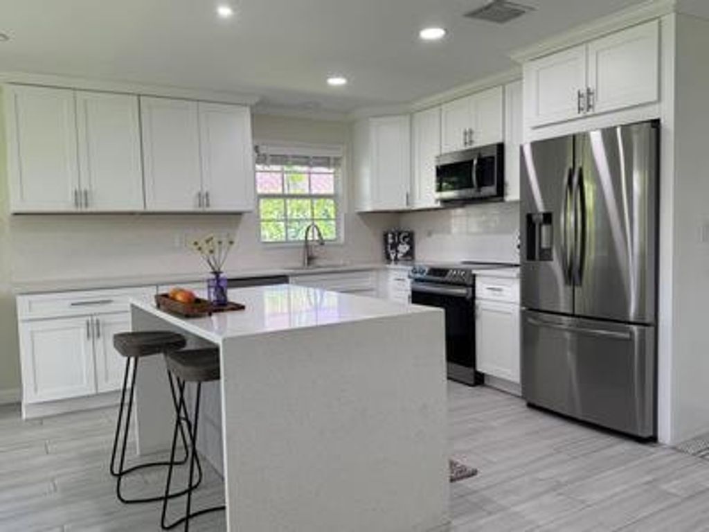 Photo of 3127 Lakeview Boulevard, Delray Beach, FL 33445 (MLS # R11130592)