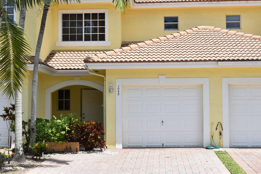 Beautifully well maintained townhome located in a highly desirable, gated community. Featuring spacious living areas, 2 bedrooms + 2.5 bathrooms with 1-car garage and an extended driveway accommodating 2 vehicles and an open-concept layout. The upgraded kitchen with granite counter top, stainless steel appliances. Conveniently located just minutes from the Turnpike, major shopping, restaurants, schools, and Palm Beach International Airport.Low HOA fee. , which includes internet, Cable TV, landscaping, Gate.