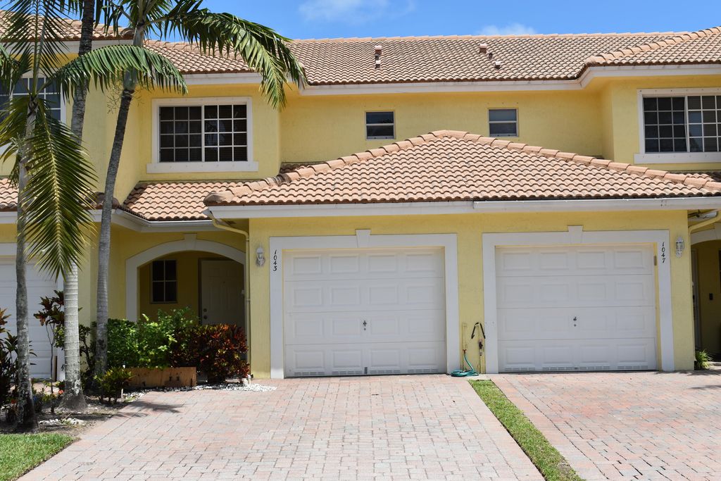 Photo of 1043 Imperial Lake Road, West Palm Beach, FL 33413 (MLS # B26027174)