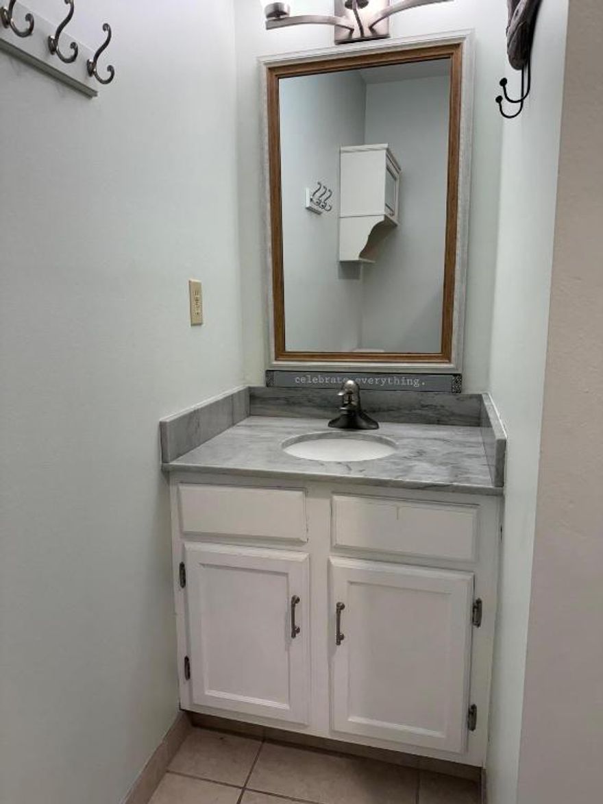 Very desirable location.  This 2 bedroom/2 bath condo is on the 1st floor.  Kitchen and both bathrooms have been updated.  Guest shower is level with the bathroom floor for easy access. Unit has stack washer and dryer, tile floors and recessed lighting.  Enclosed patio looks out on parking lot and golf course.  Easy access to your designated parking spot. Guest parking is close by.  Mailbox is close by - just down the hall.
Close to beach, shopping and restaurants.