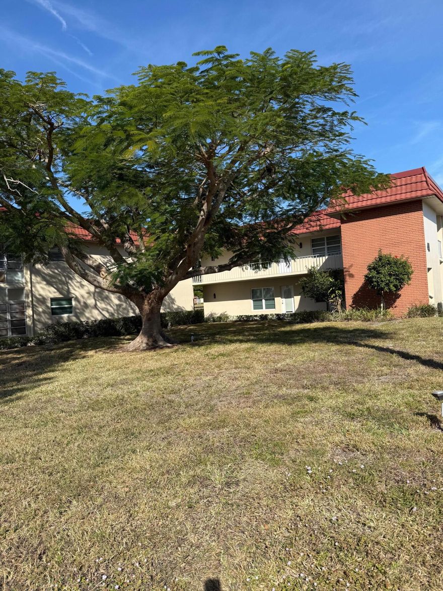 Very desirable location.  This 2 bedroom/2 bath condo is on the 1st floor.  Kitchen and both bathrooms have been updated.  Guest shower is level with the bathroom floor for easy access. Unit has stack washer and dryer, tile floors and recessed lighting.  Impact Windows!! Enclosed patio looks out on parking lot and golf course.  Easy access to your designated parking spot. Guest parking is close by.  Mailbox is close by - just down the hall. **55+ community**
Close to beach, shopping and restaurants.