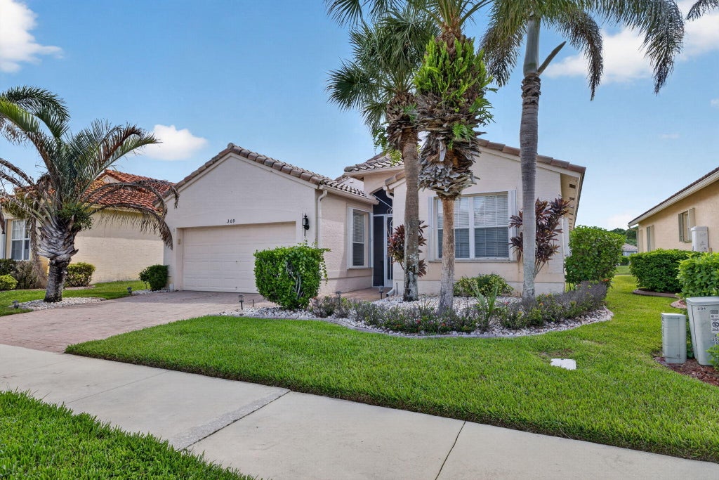 Photo of 309 NW Toscane Trail, Port Saint Lucie, FL 34986 (MLS # B26072699)