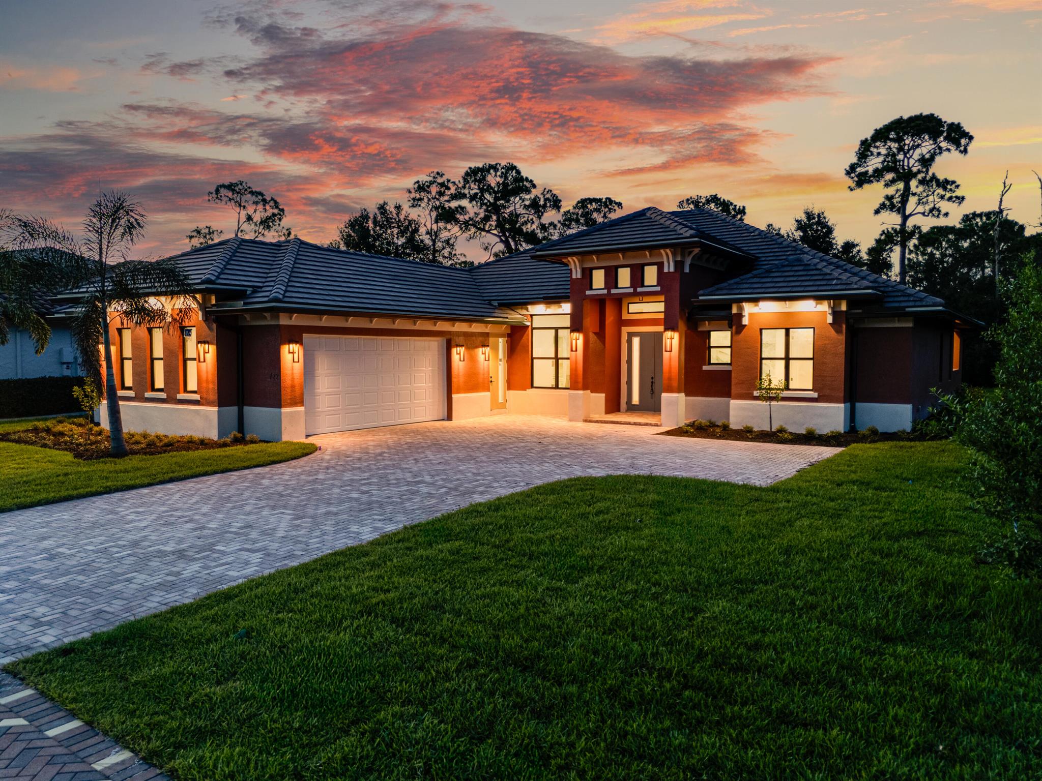 Build complete, now move-in ready! This is the only home of its kind, a custom, never-before-built design in the gated community of Rivella, set on a premium corner lot with preserve views. Inside, you'll find 12' ceilings, exposed beams, and triple impact sliders leading to a covered lanai with outdoor kitchen and fireplace. The chef's kitchen includes quartz counters, custom cabinetry, and a walk-through butler's pantry. The primary suite offers a freestanding tub, oversized shower, and full privacy. Enjoy walkable access to the clubhouse, pool, and tennis. Located near Jensen Beach, downtown Stuart, botanical gardens, and upscale shopping. No closing costs with preferred lender.