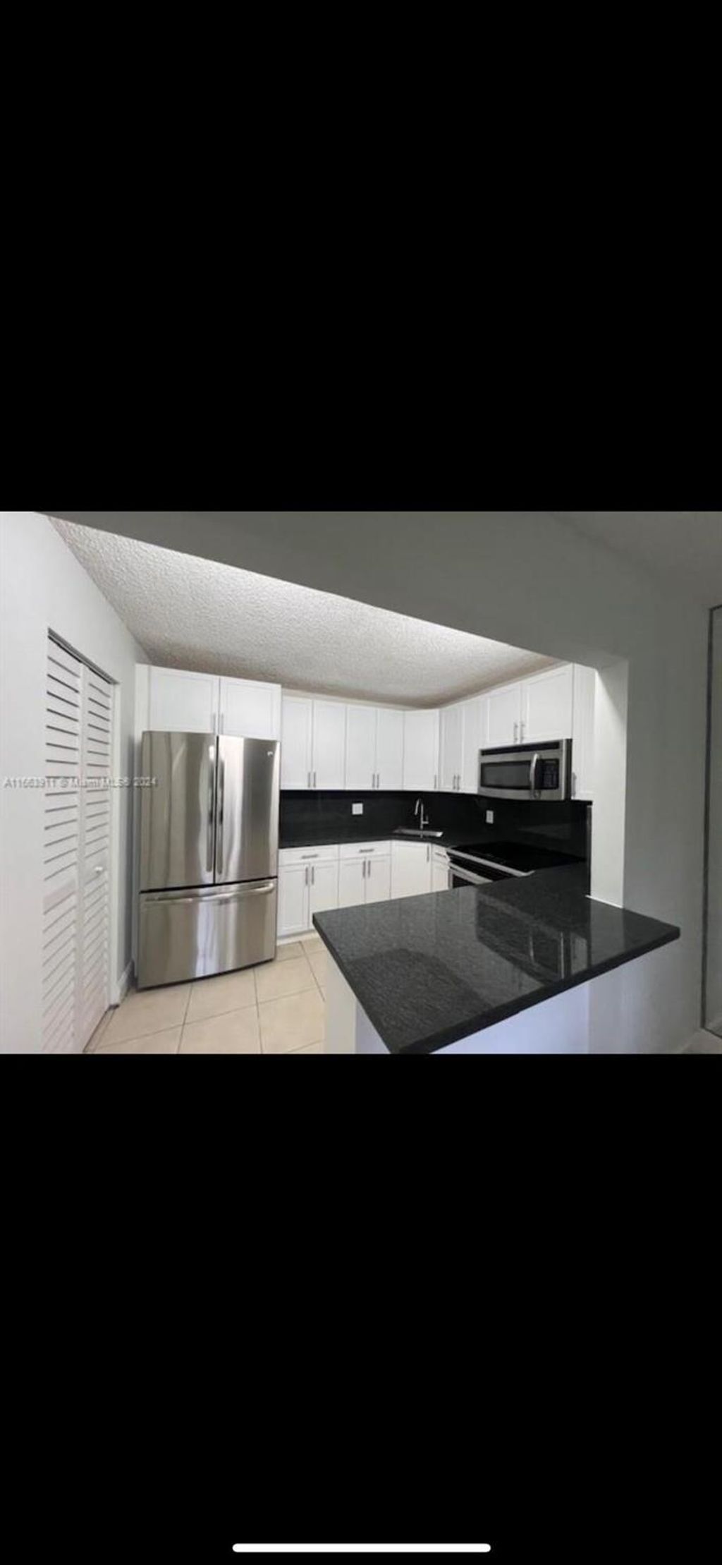 Photo of 307 Pine Ridge Circle #C1, Greenacres, FL 33463 (MLS # R11093215)