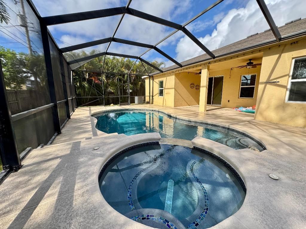 Photo of 520 SW Dailey Avenue, Port Saint Lucie, FL 34953 (MLS # R11144585)