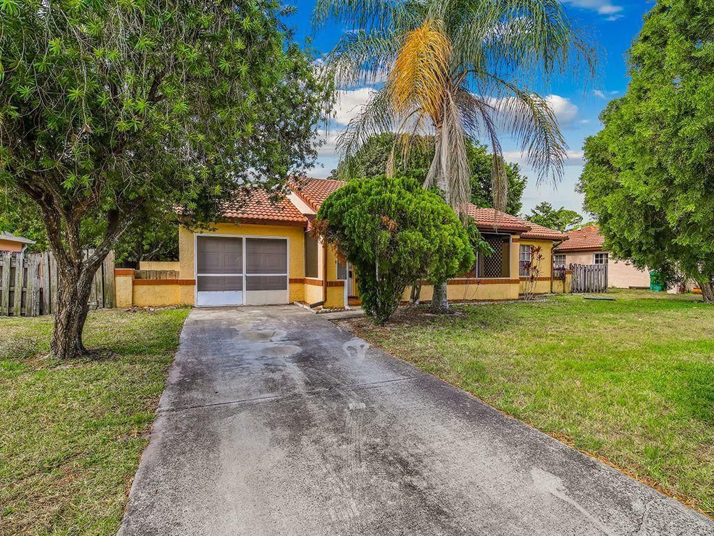 Photo of 1442 SW Sudder Avenue, Port Saint Lucie, FL 34953 (MLS # R10719961)