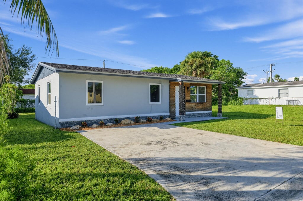 Photo of 3040 NW 8TH Place, Fort Lauderdale, FL 33311 (MLS # B26089160)