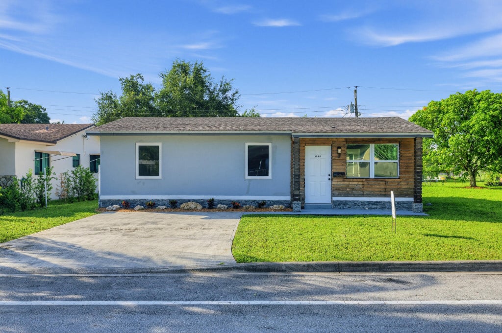 Photo of 3040 NW 8TH Place, Fort Lauderdale, FL 33311 (MLS # B26089160)