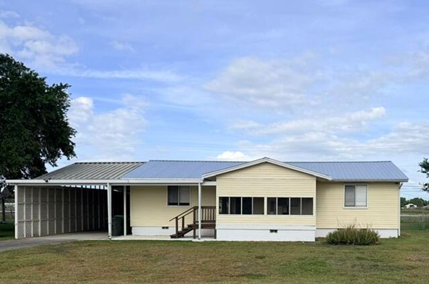 Beautifully updated 3-bedroom, 2-bathroom home located in the peaceful community of Clewiston. This charming property features renovated kitchen and bathrooms with new flooring, plus a new oven, refrigerator, and dishwasher. Enjoy propane appliances, a propane tankless water heater only 3 years old, plaster walls, and a new AC installed in 2021. Relax on the screened-in front porch or back porch overlooking the fenced backyard. Property also includes 2 sheds, a storage container with electricity, and a covered carport with electric. New roof completed in 2025. Located on a quiet dead-end street with beautiful backyard views and an average monthly FPL bill of approximately $150.
