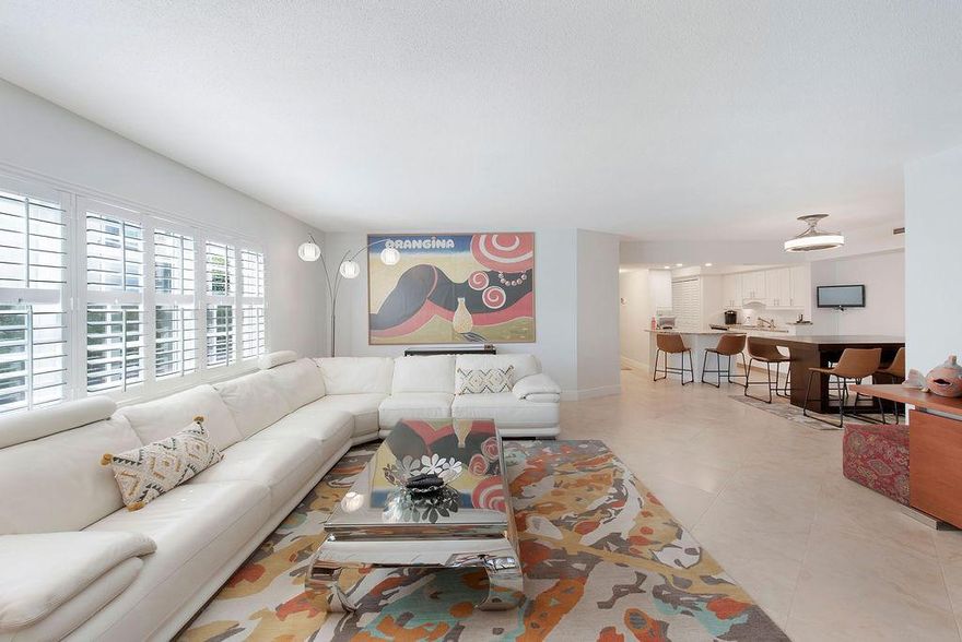 Beautifully remodeled, turnkey, first floor 3/2 (patio could be a 4th bedroom) condo just steps from the sand in Delray Beach. Overlooking the intracoastal waterway and the newly completed Tiki hut/ outdoor kitchen pool enclave. This unit has the feel of a professionally designed modern home with ALL the expected accouterments. Split floor plan, open spaces, dining for up to 8 people, hurricane windows and plantation shutters, stainless appliances & full size washer and dryer. Rental comes with water, cable, internet and brand new furniture, TV's and linens. Additional BONUS is full access to 2 beach chairs and umbrella at the beach for your use AND the owners will supply a cleaning crew once per month! Shoulder season months are also available. Hurry, this diamond won't last..