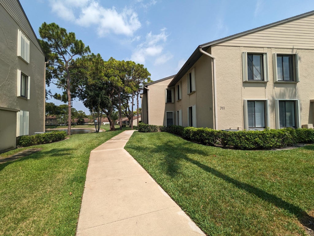 Photo of 711 Sunny Pine Way #B1, Greenacres, FL 33415 (MLS # B26058117)