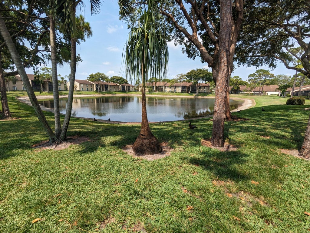Photo of 711 Sunny Pine Way #B1, Greenacres, FL 33415 (MLS # B26058117)