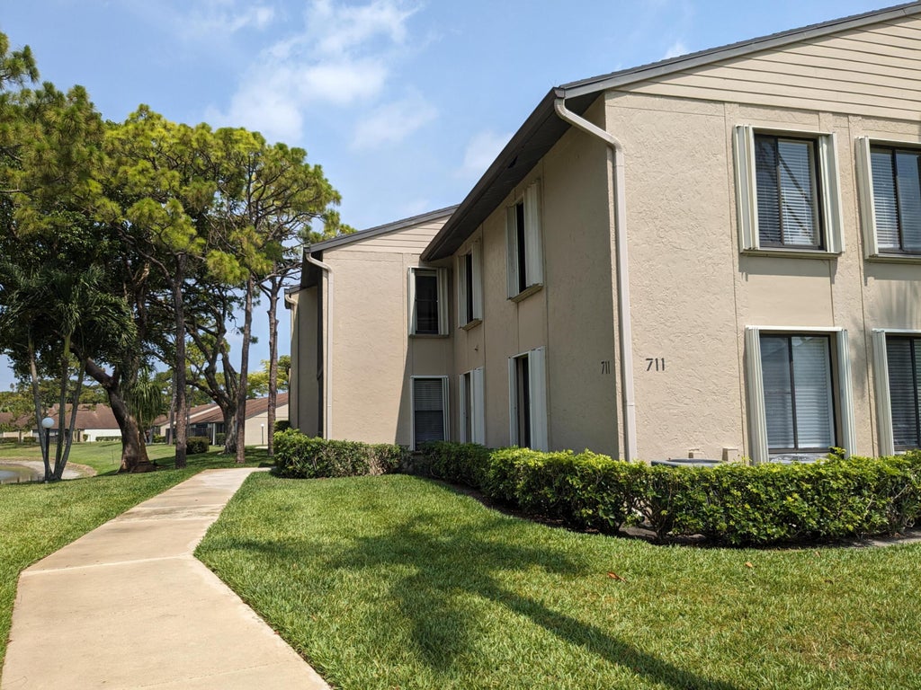 Photo of 711 Sunny Pine Way #B1, Greenacres, FL 33415 (MLS # B26058117)