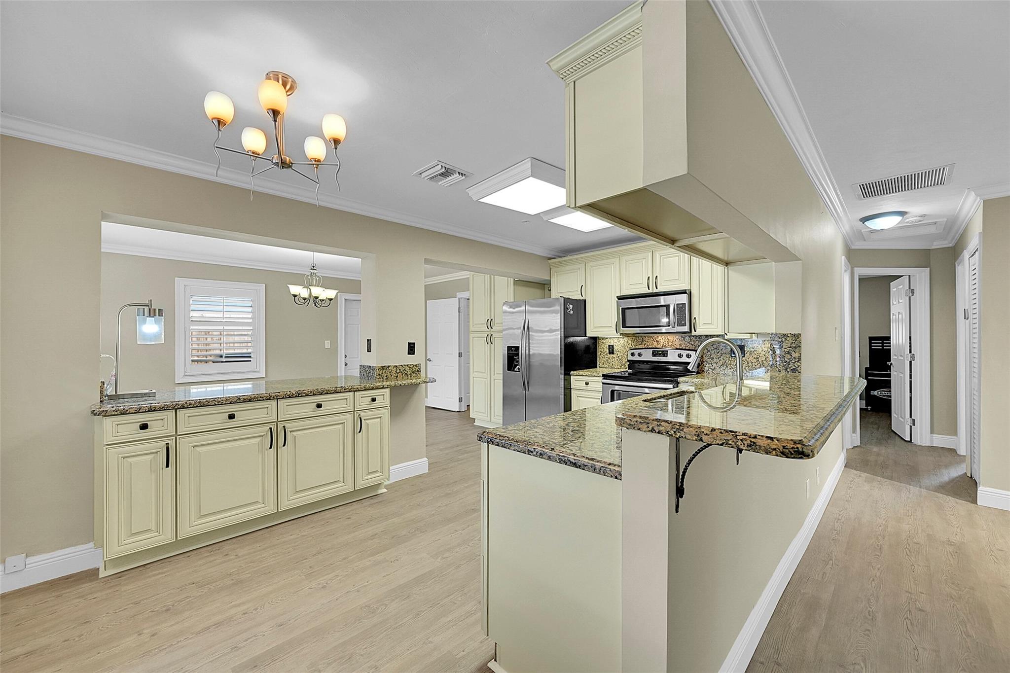 Discover this spacious 3-bedroom, 2-bath home in Oakland Park! Featuring a 7-year-old roof, Impact Windows and Doors, and a freshly painted interior with new floors, this home is move-in ready. The updated kitchen offers modern style and functionality, perfect for cooking and entertaining. Enjoy peace of mind with quality upgrades throughout. Ideally located near booming Downtown Oakland Park, with easy access to shopping, dining, highways, and just minutes from the beach—this home blends comfort, style, and convenience in a prime location!