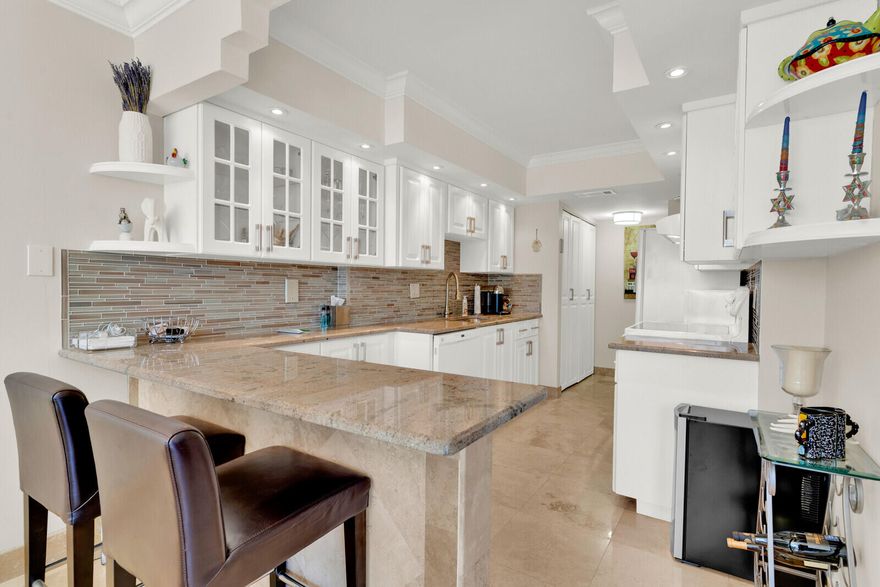 Gorgeous, updated penthouse in East Boca's Porta Bella! Enjoy serene canal views from this spacious condo featuring a large living area, separate dining room, and an oversized kitchen with breakfast bar. The master suite is generously sized also offering canal views. Porta Bella has completed all renovations—no upcoming assessments. Resort-style amenities include a modern fitness center, beautiful pool area, tiki bar, community room, billiards and more. Prime location near beaches, dining, and shopping. Move-in ready and perfect for full-time living or a seasonal escape! P.S. Brand New A/C!