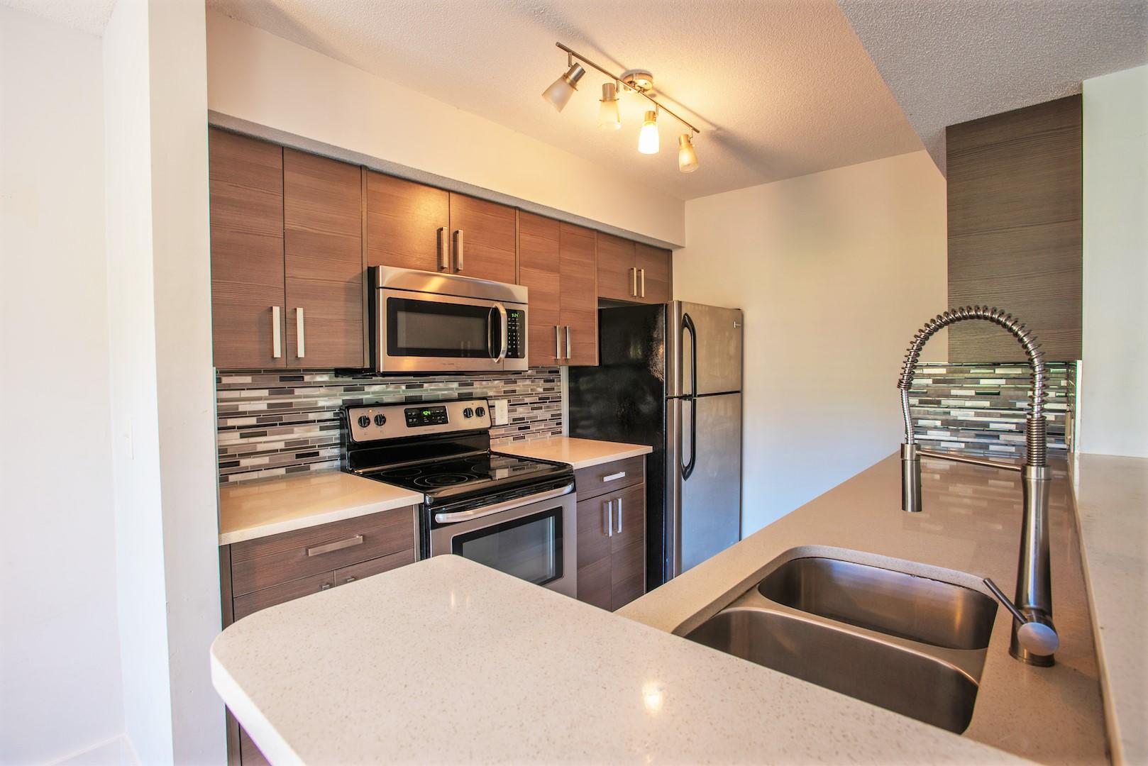 Welcome to this updated and well-maintained 1-bedroom, 1-bathroom first-floor condo located in the desirable Casablanca Isles community in the heart of Boynton Beach. This light-filled unit features a spacious and functional layout with tile flooring throughout, a modern kitchen with quartz countertops and stainless steel appliances, in-unit washer and dryer, and a private screened-in patio ideal for morning coffee or evening relaxation. The bedroom offers a large walk-in closet and easy access to the full bath, creating a comfortable and private living space. Enjoy the convenience of assigned parking located near the unit and plenty of guest parking for visitors.Casablanca Isles is a very convenient community with fantastic amenities, including a community pool, hot tu
