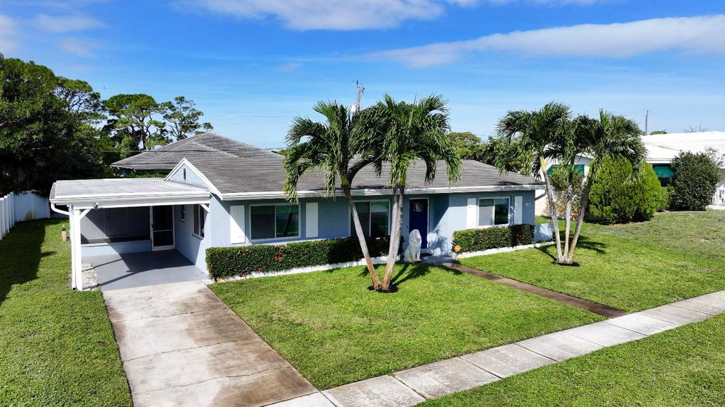 Photo of 1615 Crest Drive, Lake Worth, FL 33461 (MLS # R11139981)