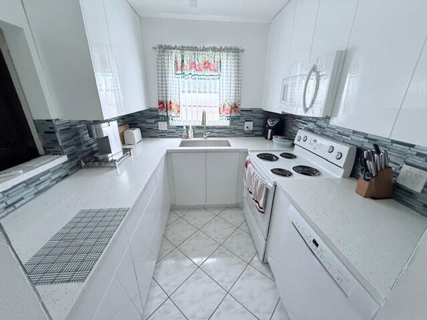 This second floor corner 1 1.5 in desirable Upminster section across from Pickeball courts has central air. Offered furnished. Updated kitchen. Century Village offers the finest 55plus amenities with its massive clubhouse featuring 1700 seat theater, fitness center, indoor and outdoor pools, restaurant,wood shop, stained glass shop, clay room, billiards, table tennis and so much more!