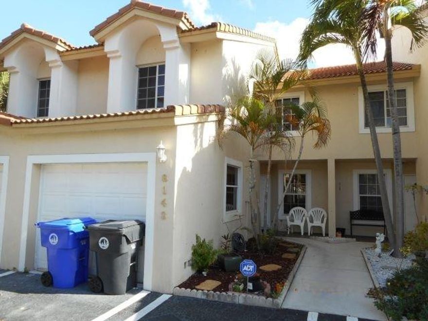 Explore this spacious 3-bedroom townhome boasting a converted garage for a fourth room. Laminate flooring enhances the entire home, complementing the updated kitchen featuring granite countertops. The beautiful interior includes optional furniture for an additional fee. Step outside to a delightful patio overlooking a vast open land, perfect for entertaining guests. Enjoy the blend of comfort, style, and versatile living spaces in this charming property.