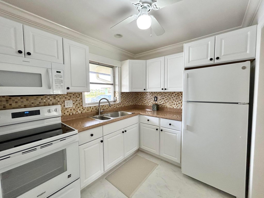 Photo of 2915 Crosley Drive W #A, West Palm Beach, FL 33415 (MLS # B26083645)