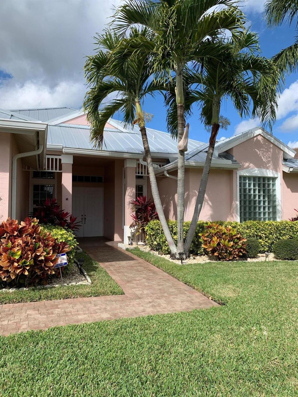 Photo of 137 NW Magnolia Lakes Boulevard, Port Saint Lucie, FL 34986 (MLS # R10768611)